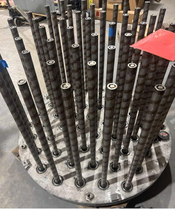 A full array of threaded risers set into a tubesheet.