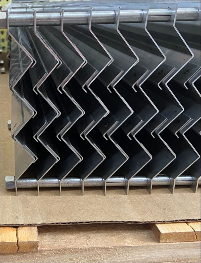 An FNS vane pack with even spacing, open drainage hooks and heavy-gauge stainless vanes.